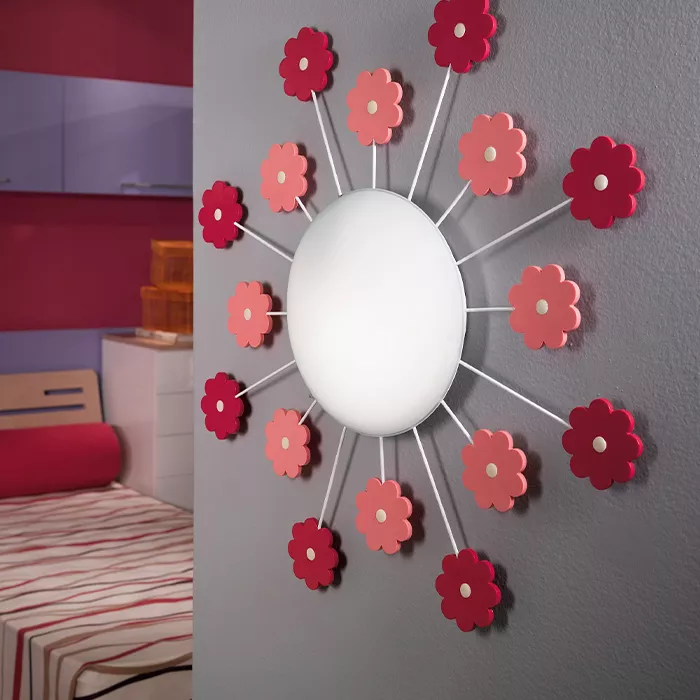 Darc — Applique murale circulaire avec douze fleurs en papier ou plastique, alternant roses et rouges, disposées en étoile autour d'une source lumineu