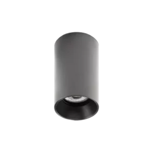 Darc — Applique murale cylindrique en métal noir mat, avec un rebord dentelé et une lumière dirigée vers le bas, sur fond noir.