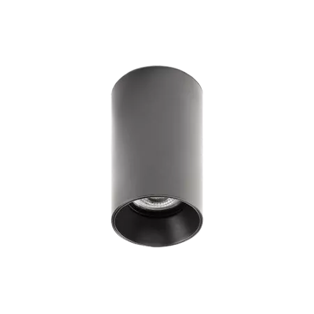 Darc — Applique murale cylindrique en métal noir mat, avec un rebord dentelé et une lumière dirigée vers le bas, sur fond noir.