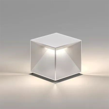 Darc — Un cube transparent en verre ou acrylique posé sur une surface claire, éclairé par en dessous pour créer une lumière douce et diffuse à l'intér