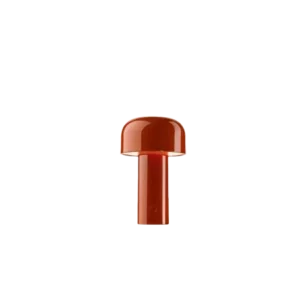 Darc — Un boulon métallique de couleur rouge avec une tête hexagonale et une tige cylindrique, posé sur un fond noir.