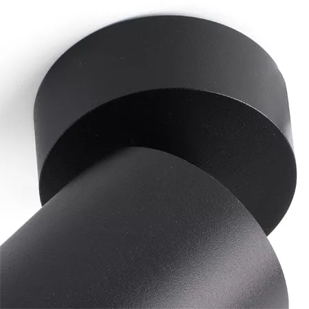 Darc — Deux disques de cuir noir mat superposés, lisses et épais, disposés en perspective pour montrer leur texture et leur forme circulaire