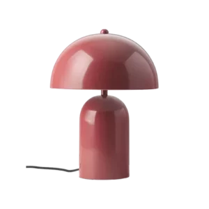 Darc — Lampe design en forme de champignon, avec un pied et un chapeau rouge brillant, posée sur une surface noire